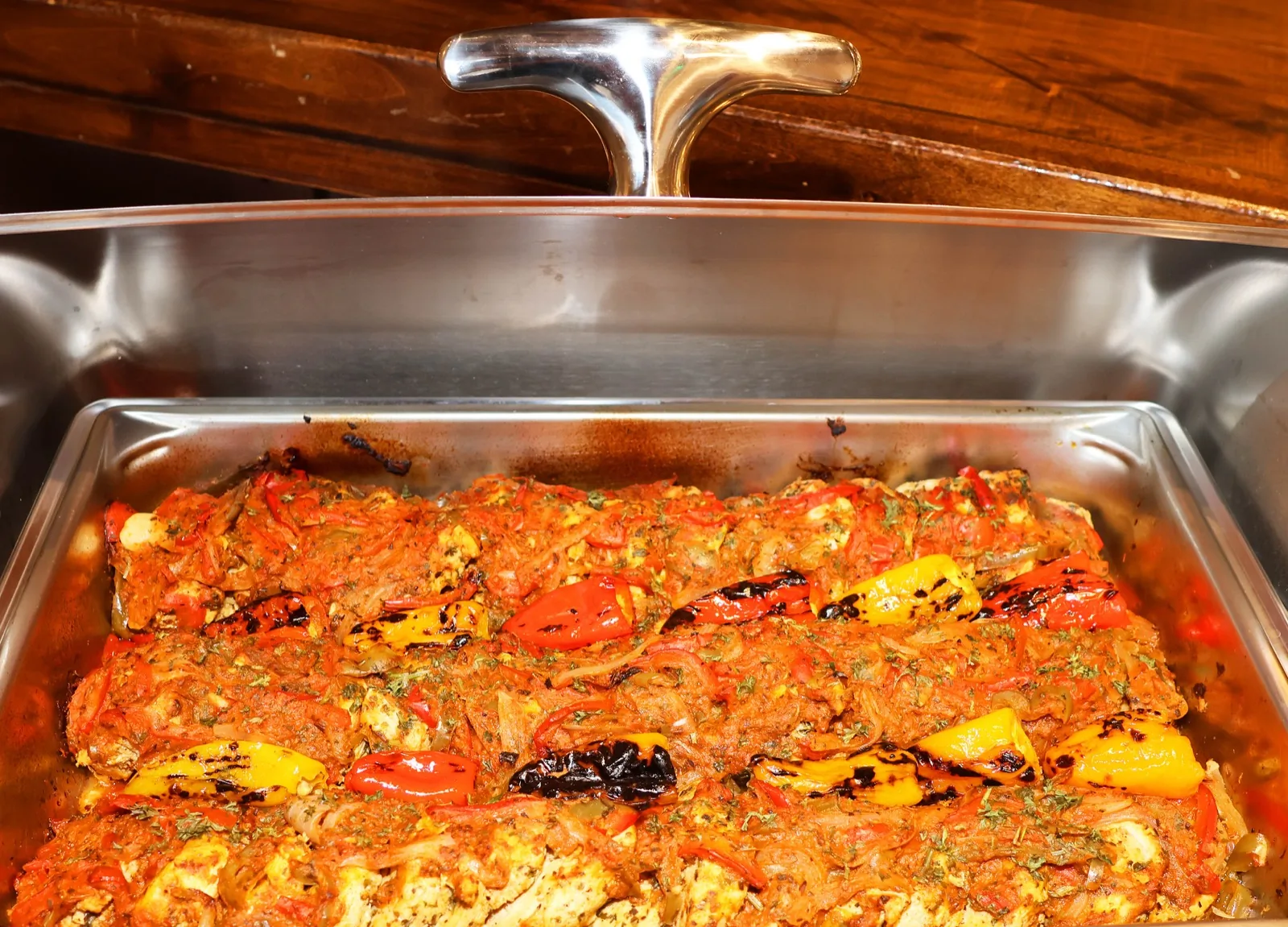 Baked fish with roasted peppers on the Sunday brunch buffet at The Venue Clermont